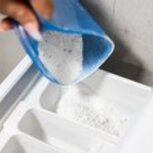 pouring-washing-powder-into-the-washing-machine-picjumbo-com