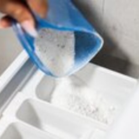 pouring-washing-powder-into-the-washing-machine-picjumbo-com
